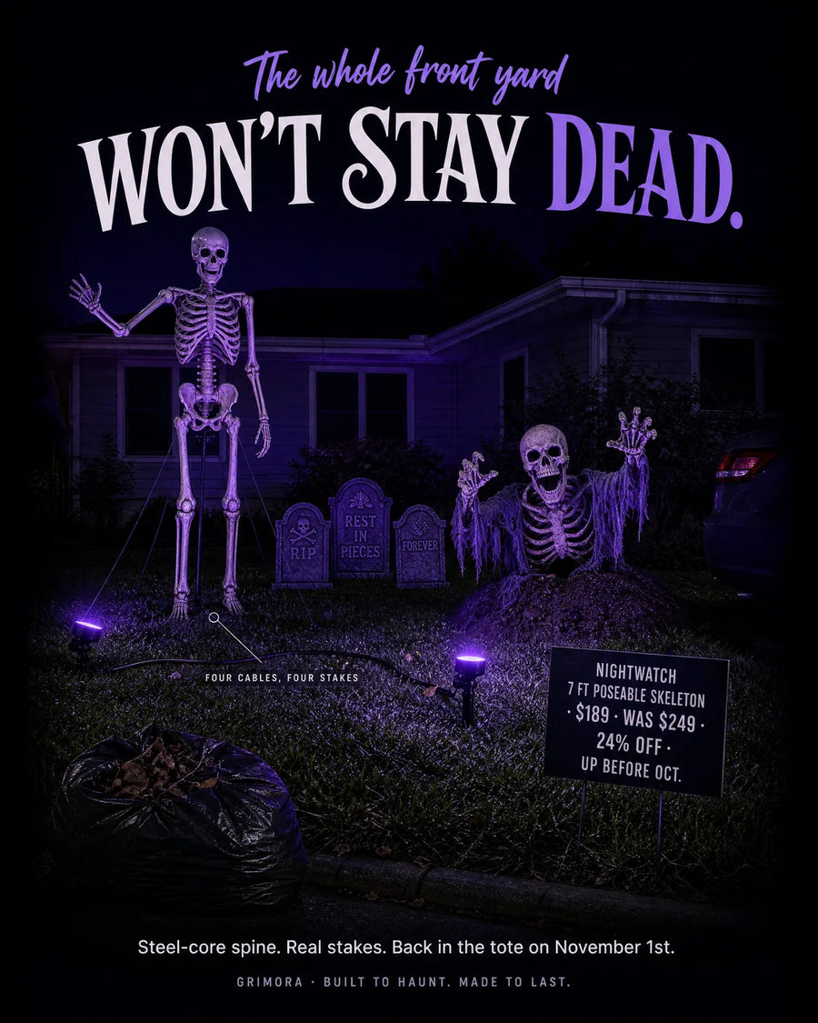 Seven feet, a steel-core spine and four stakes in the lawn. Pose it once in September and it holds that pose through every storm October sends.